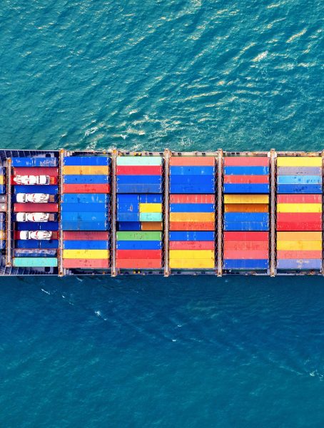 Aerial view of container cargo ship in sea.