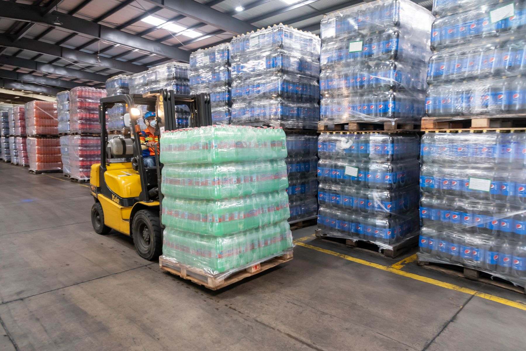Warehouse forklift moving palletized cargo
